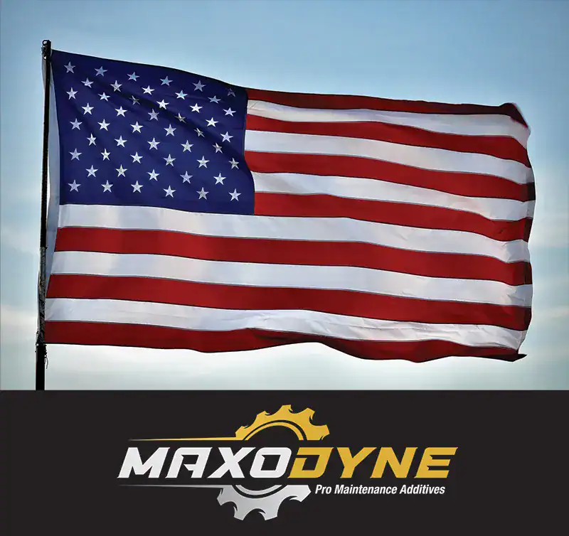 American flag waving in the wind against a clear sky.
